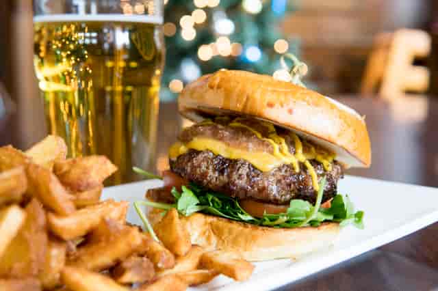 Burger with fries and a glass of beer