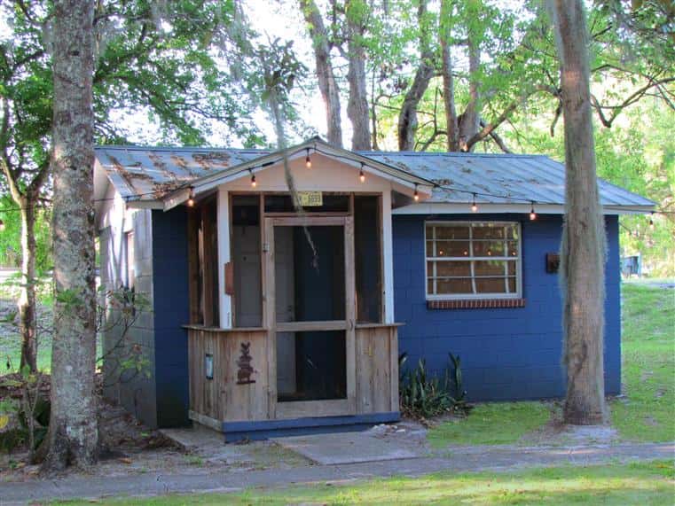 exterior of south moon under cabin next to a wooded area