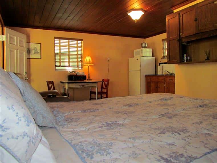 interior of south moon under cabin showcasing the large bedroom and kitchen area