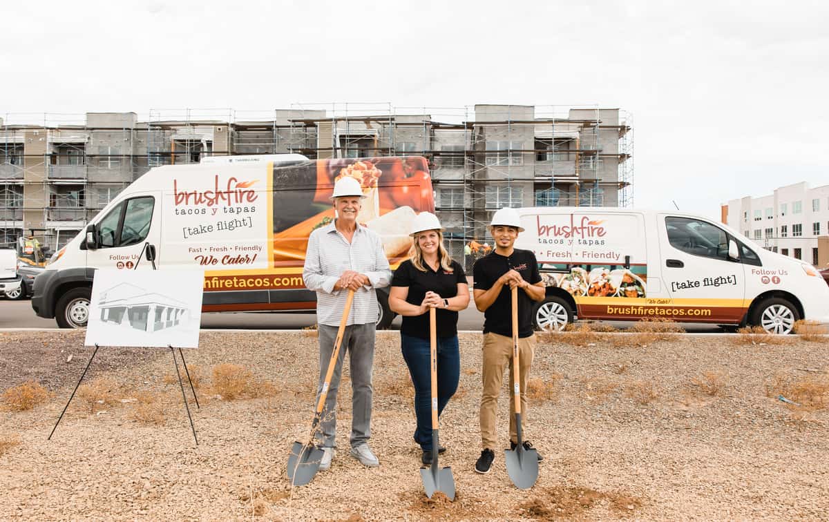 2 mans and a woman with shovels