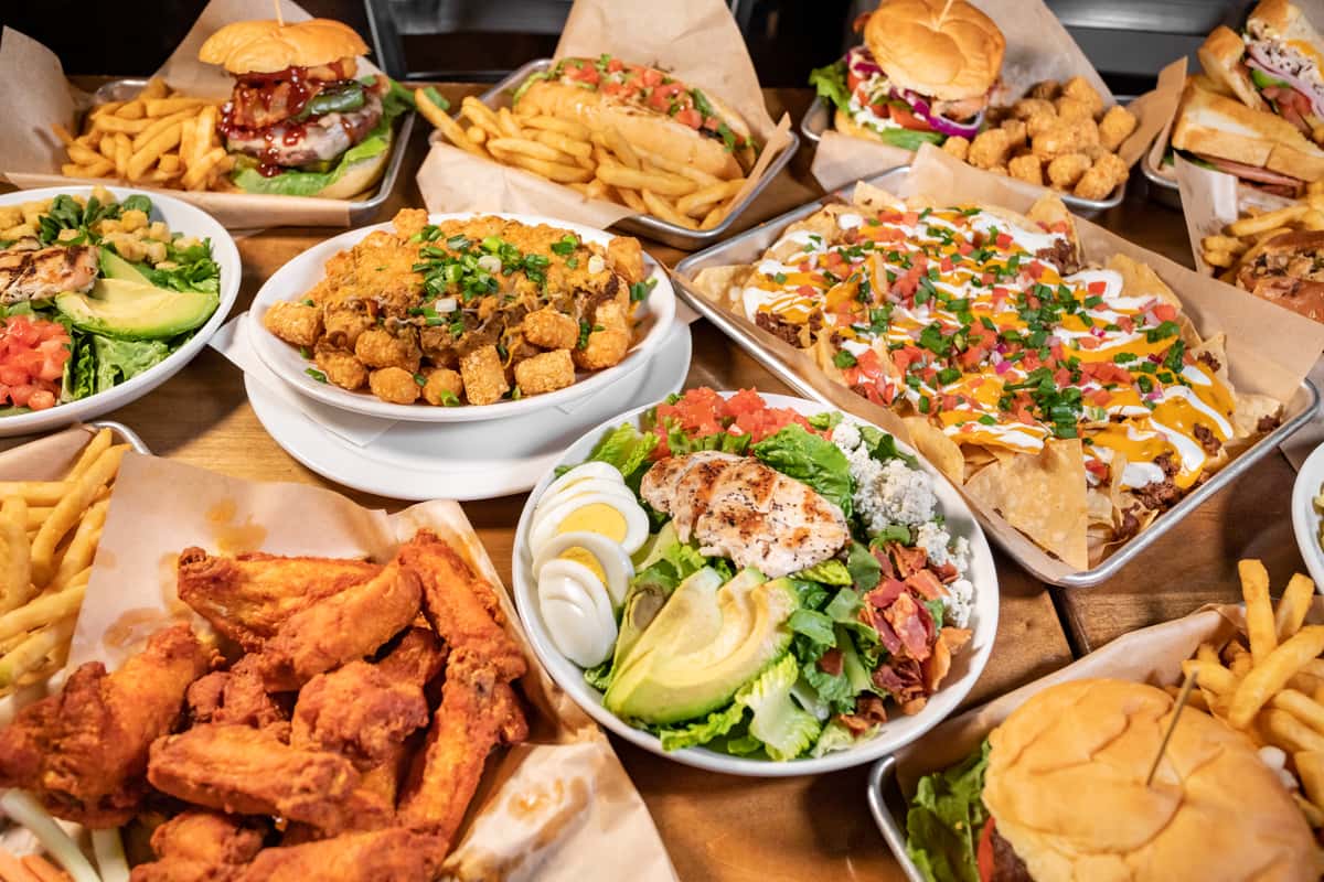 Variety of pub food favorites including wings, nachos, and cobb salads