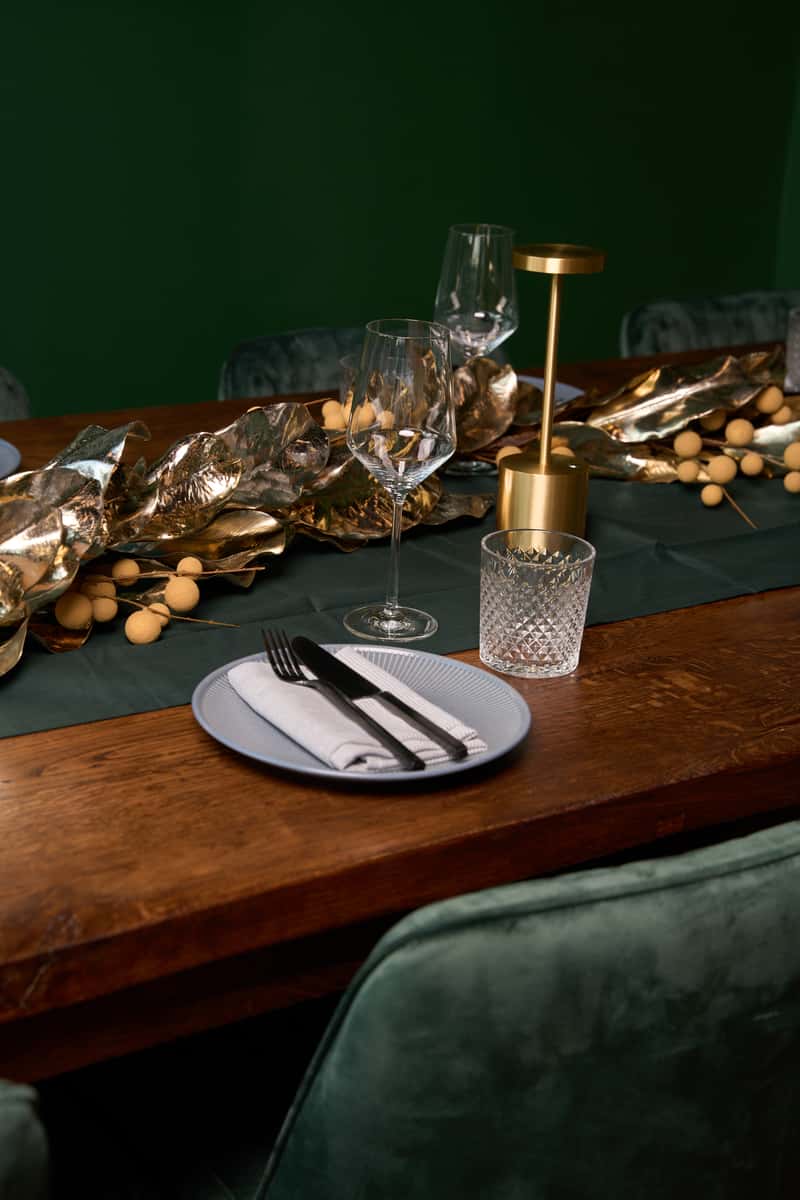 A beautifully arranged dining table for private events at Fitoor, showcasing elegant glassware and decorative elements, perfect for intimate gatherings.