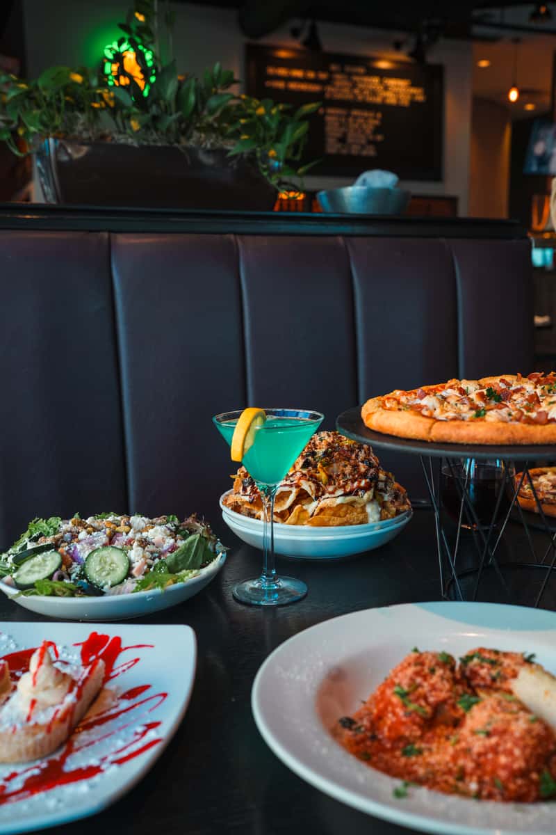 Pizza, salad, and pasta spread at Oak & Pie in Wichita, KS