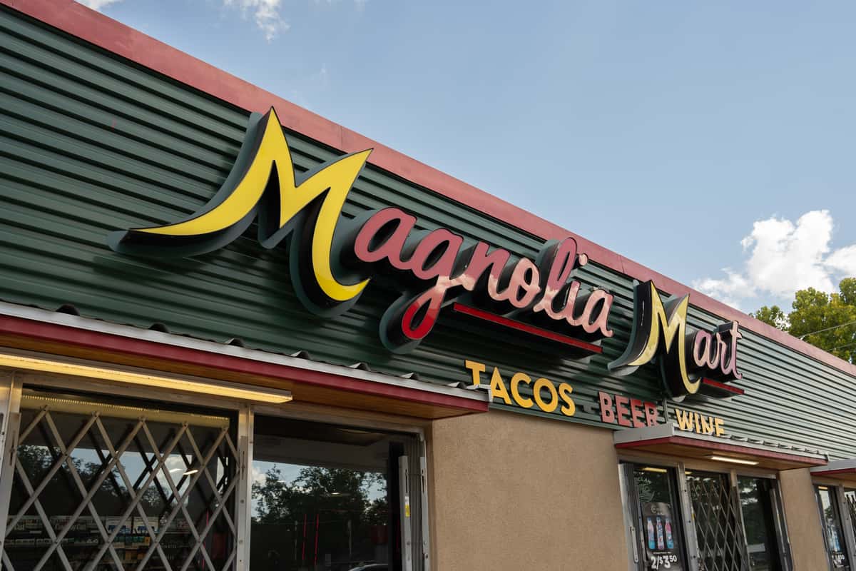 Medium exterior view of the Magnolia Mart sign and storefront.