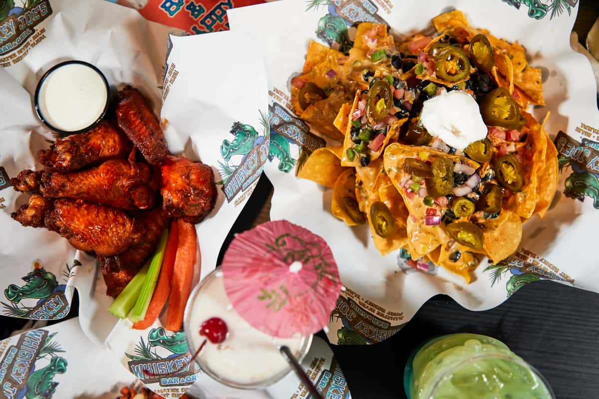 Chicken wings, nachos and cocktails