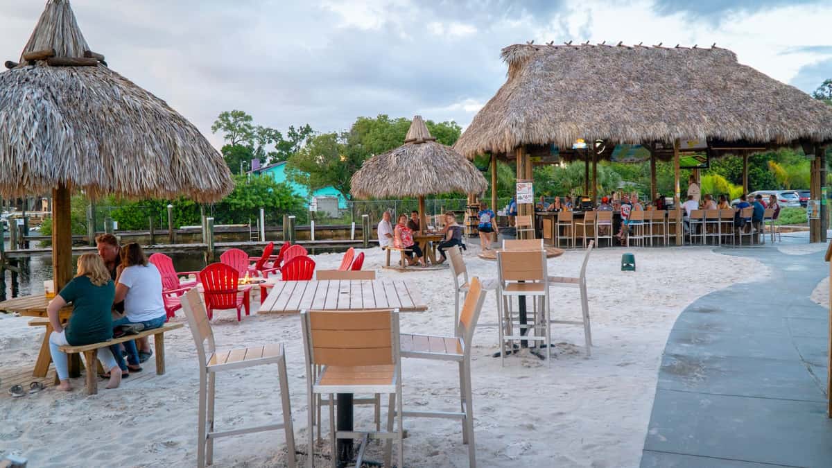 outdoor dining tables and chairs on the beach