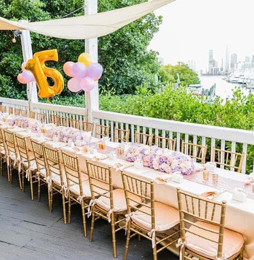 a long table decorated for a 15th birthday party