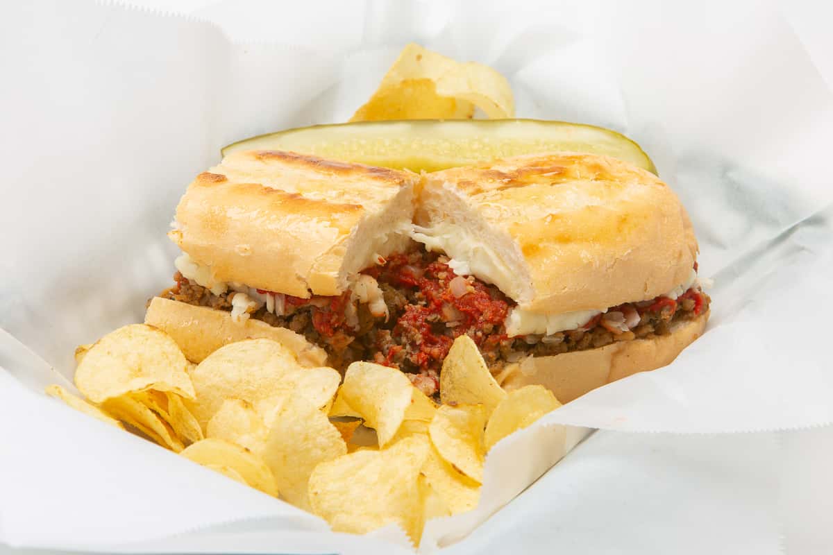 Sub sandwich served with potato chips