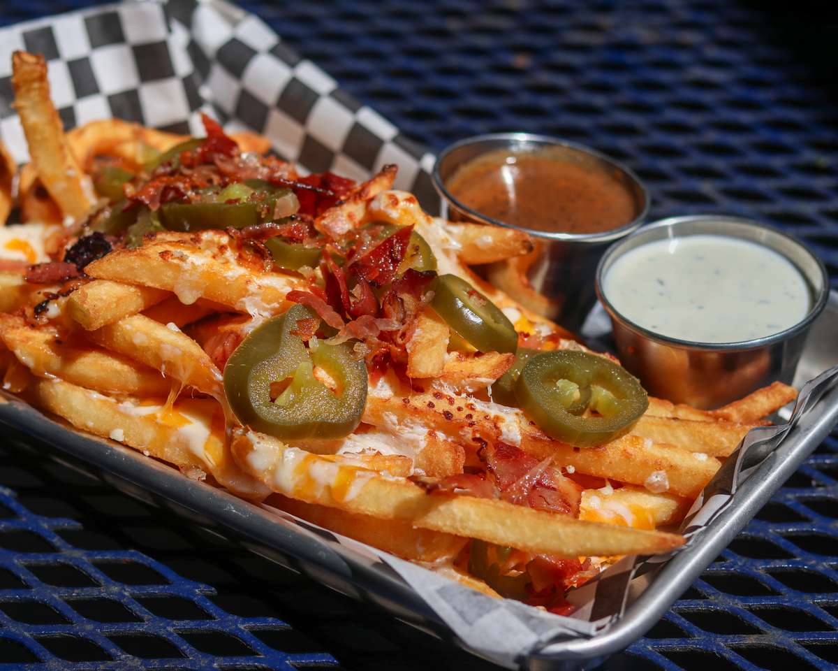 Cheddar- white American cheese blend, bacon, jalapeños, with a side of ranch and debris gravy