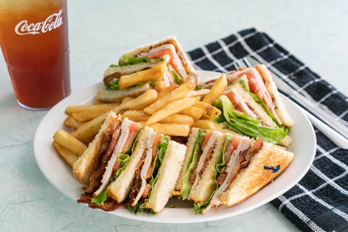 Club sandwich with fries