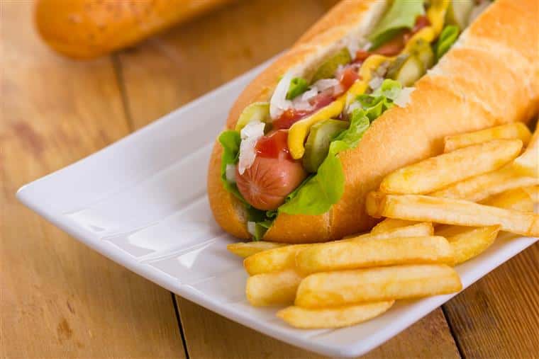 hot dog with ketchup, mustard and french fries