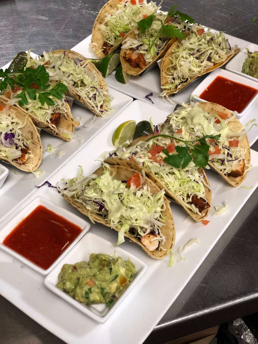 Grilled swordfish, chopped cabbage, with avocado cilantro lime sauce.