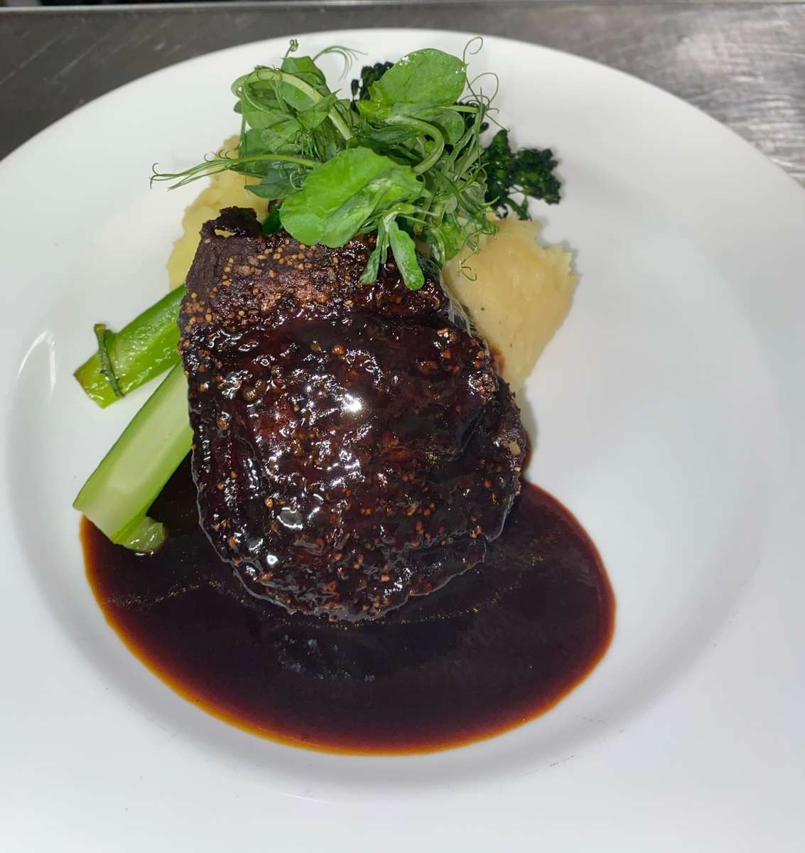 Cast Iron Filet at Restaurant Paradis Cast iron filet with mashed potatoes, broccolini and truffle demi-glace at Restaurant Paradis in Rosemary Beach