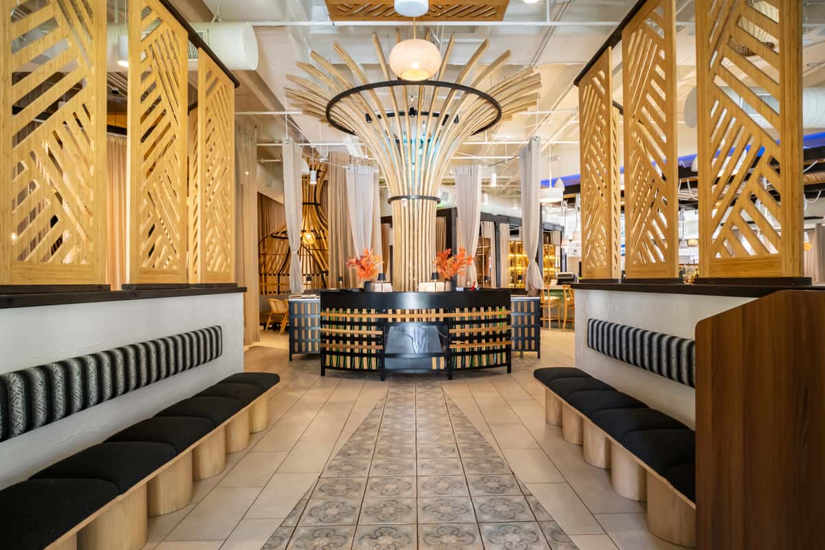 Interior entrance with seating and chandelier lighting