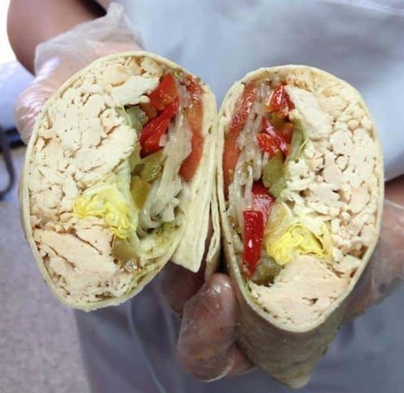 open faced wrap with meats, lettuce, onions, and peppers