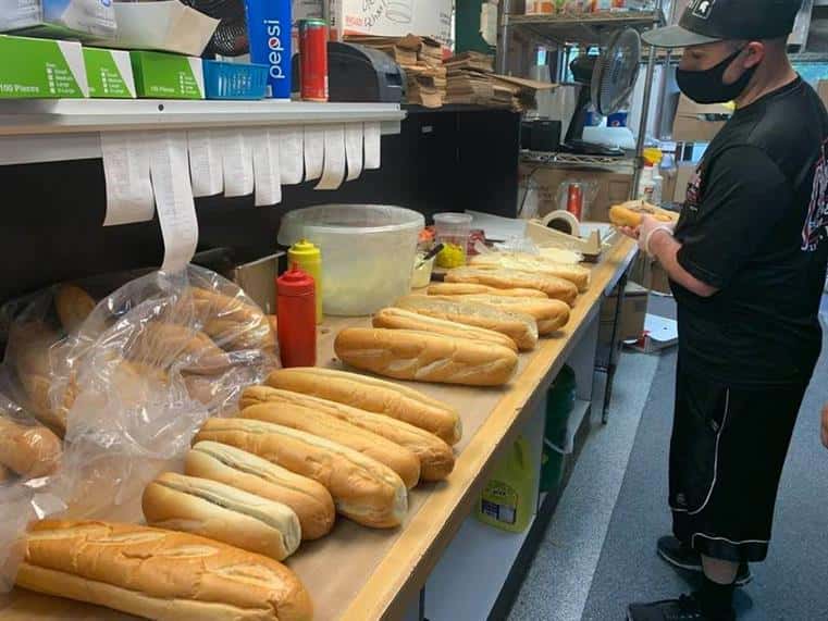 assortment of subs lined up in the kitchen