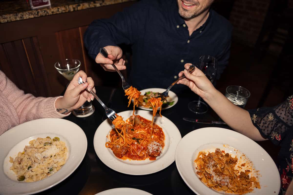 People Sharing Spaghetti at La Tavola