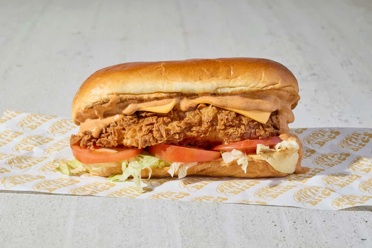 chicken sandwich with cheese and lettuce