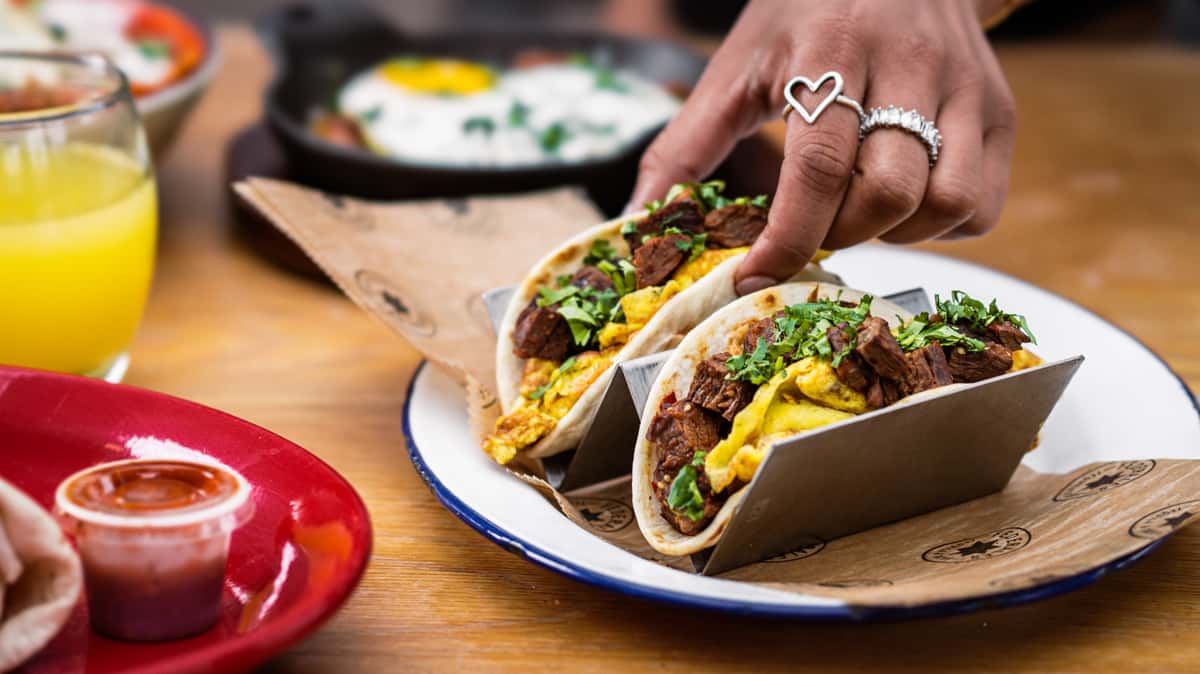 Breakfast Tacos* $14 steak, flour tortilla, chipotle aioli, scrambled eggs, cilantro, salsa roja