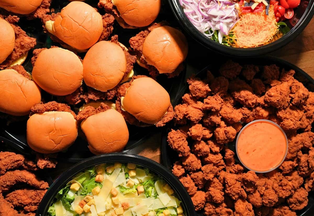 Chicken sandwich, salad and nugget trays