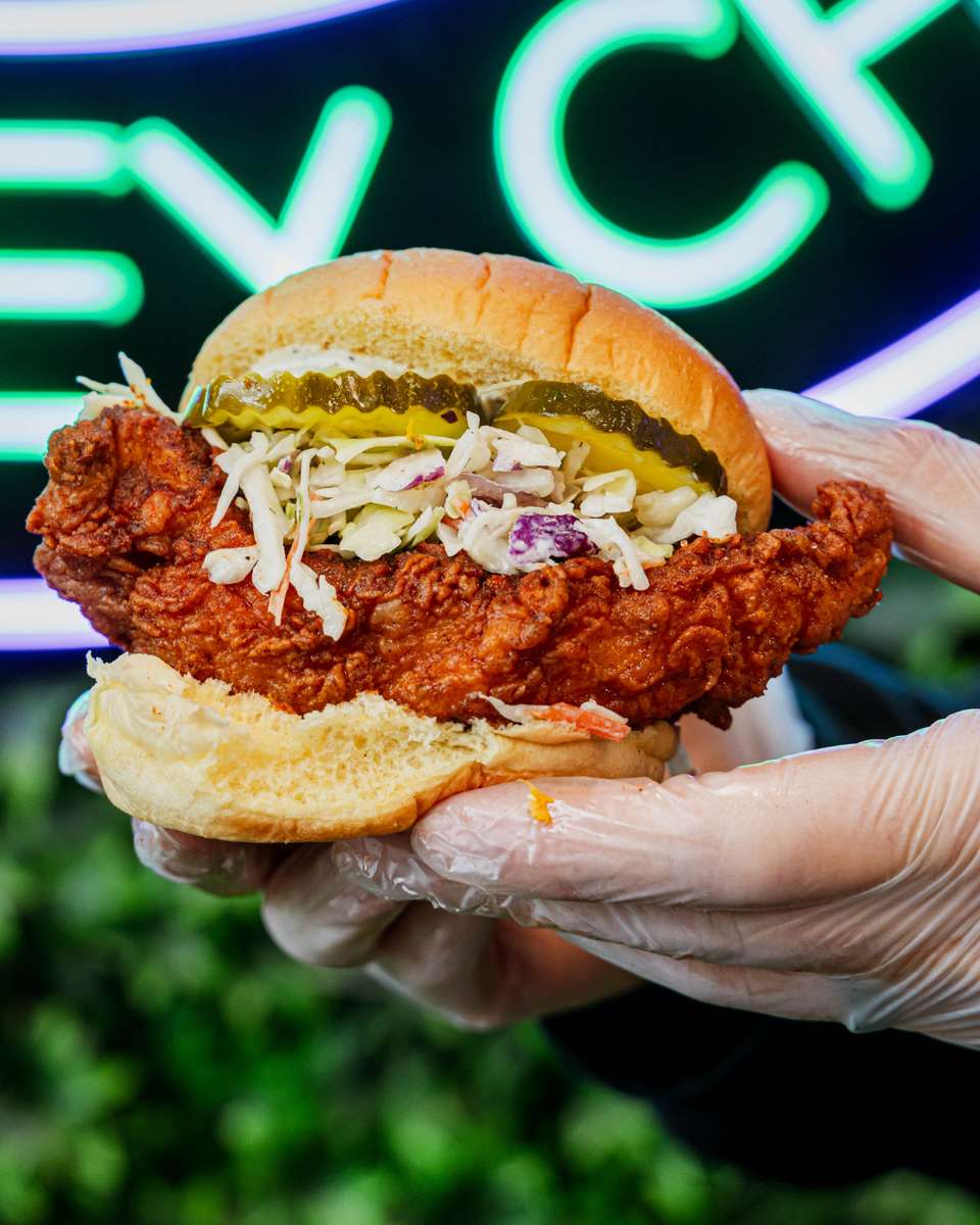 Hand holding a chicken sandwich