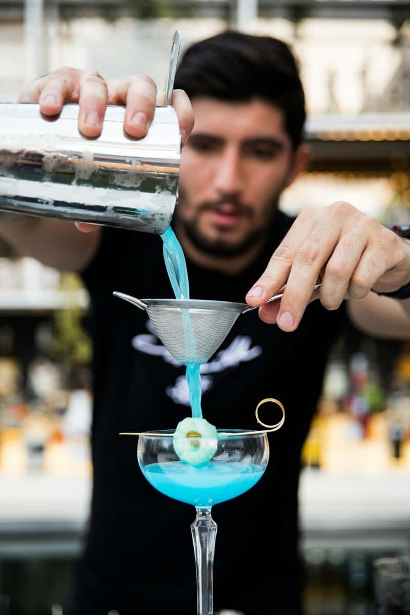Bartender pouring a cocktail