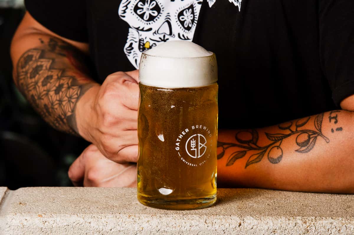 man holding kolsch mug