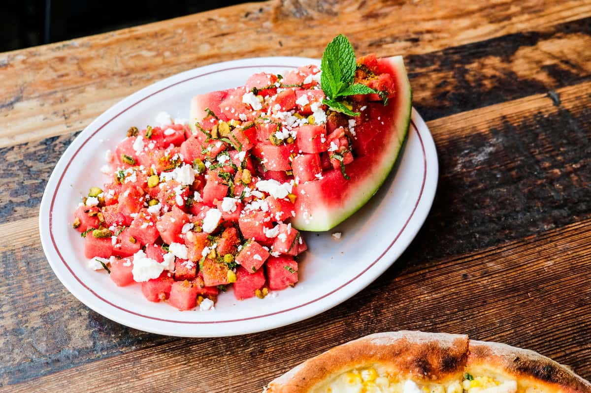 seedless watermelon, crumbled goat cheese, honey lemon vinaigrette, mint, pistachios