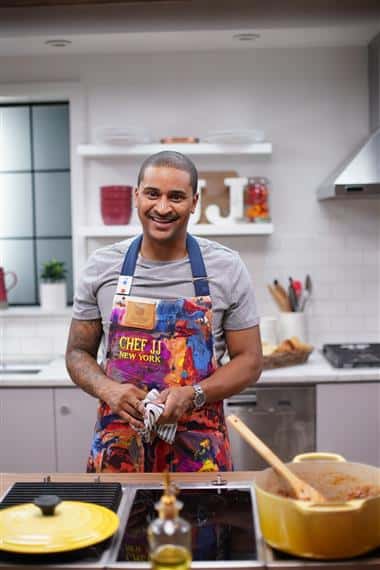 Chef JJ on set in the kitchen for the Just Eats cooking show.