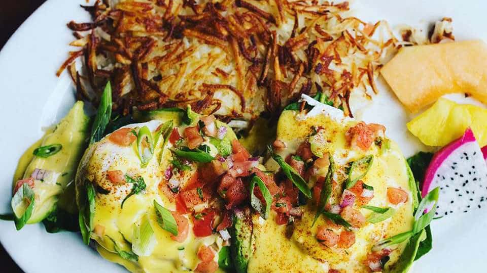 Hash browns with fresh fruit and additional breakfast items