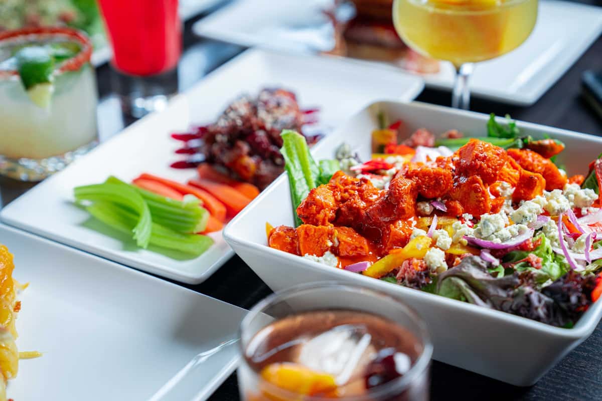 Appetizers presented in white plates