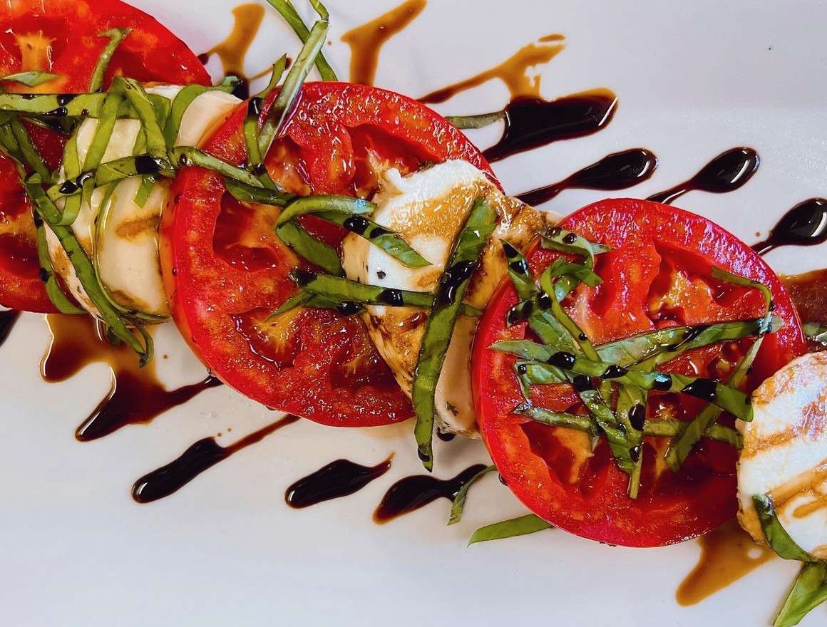 Vine ripened Tomatoes, Fresh Mozzarella, Balsamic Glaze, Basil oil & Fresh Basil with Maldon Salt