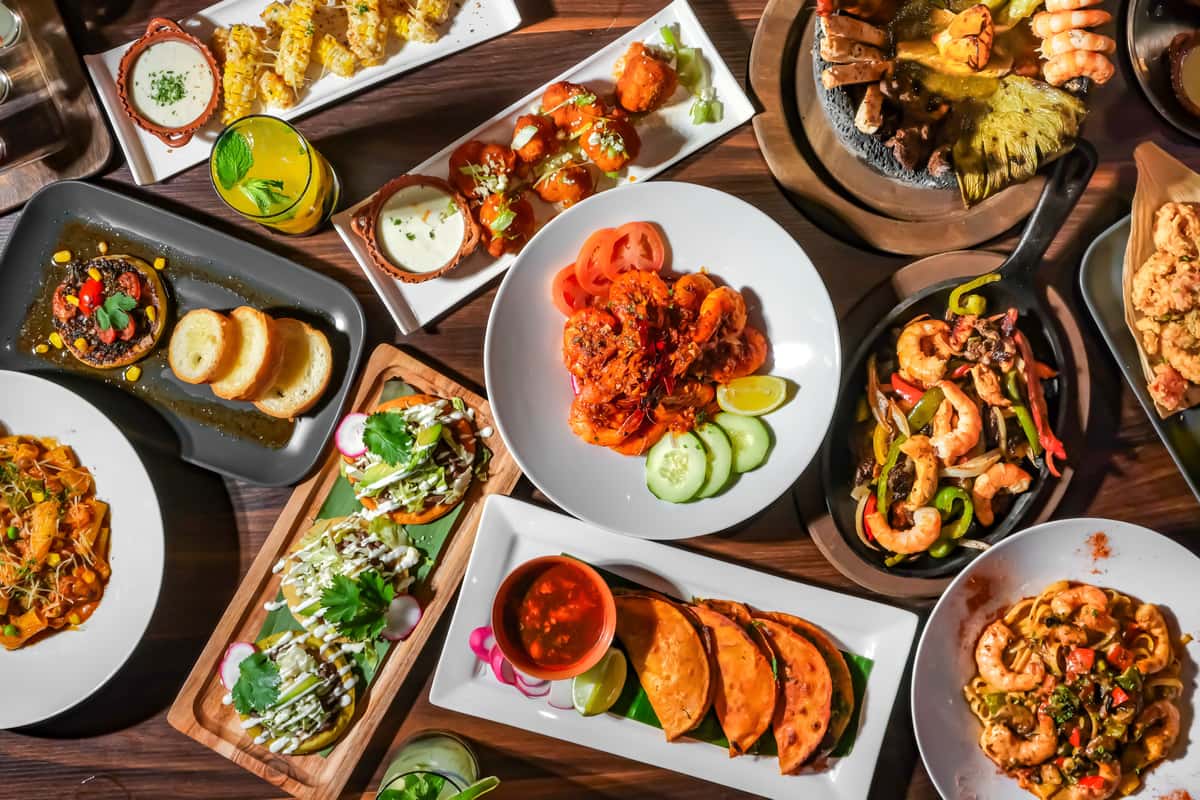 Various Mexican dishes on a table