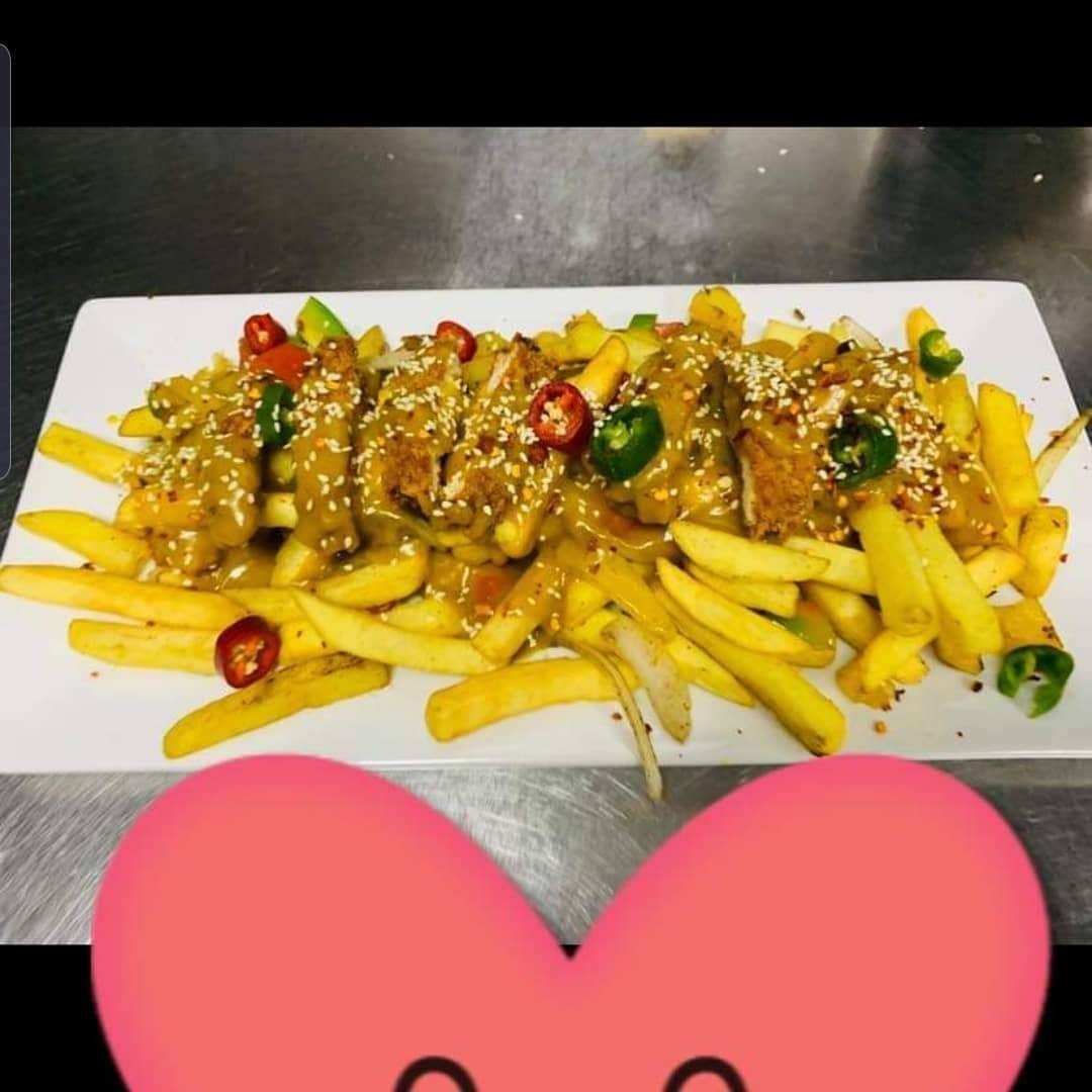 Loaded fries with fresh toppings from Peaky Grinders in Hamilton
