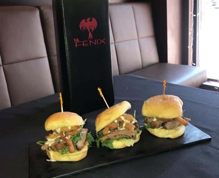 Steak Sliders. 3 New York strip steak sliders topped with baby arugula, onion straws and horsey chive sauce