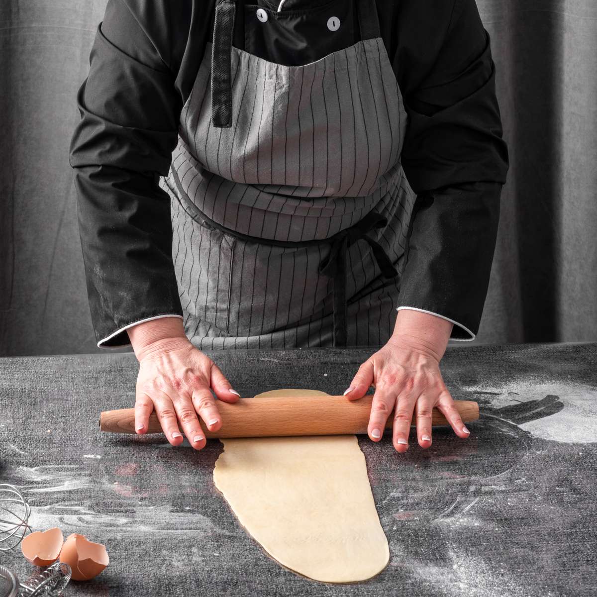 chef rolling dough