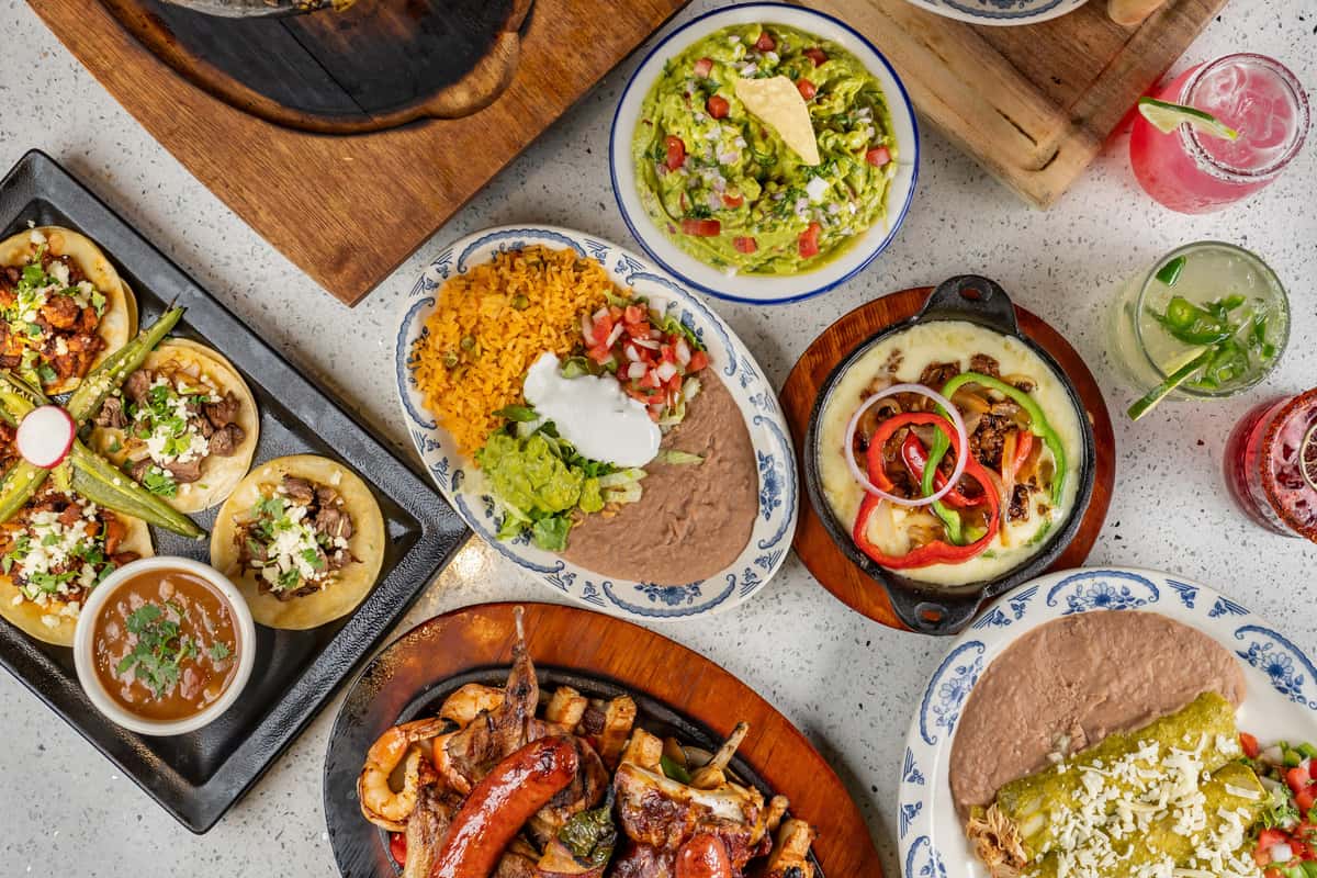 A table spread full of Mexican dishes