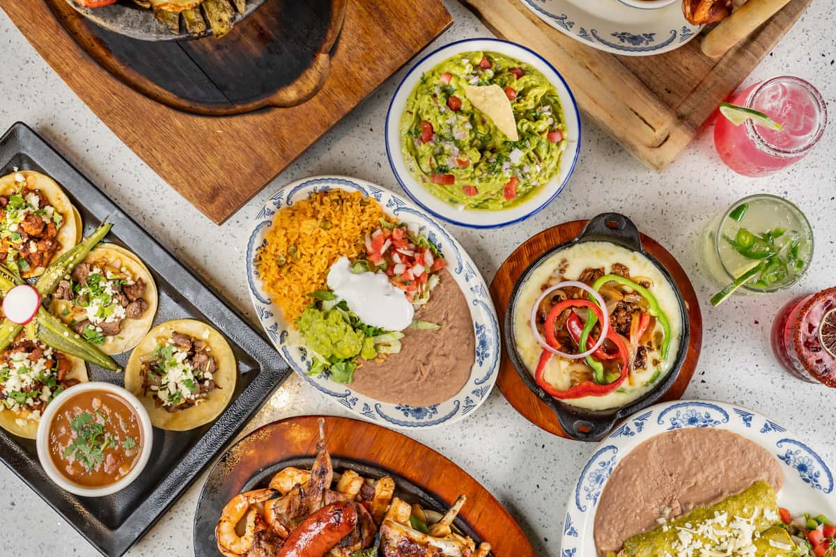 Plates of Mexican food on a table