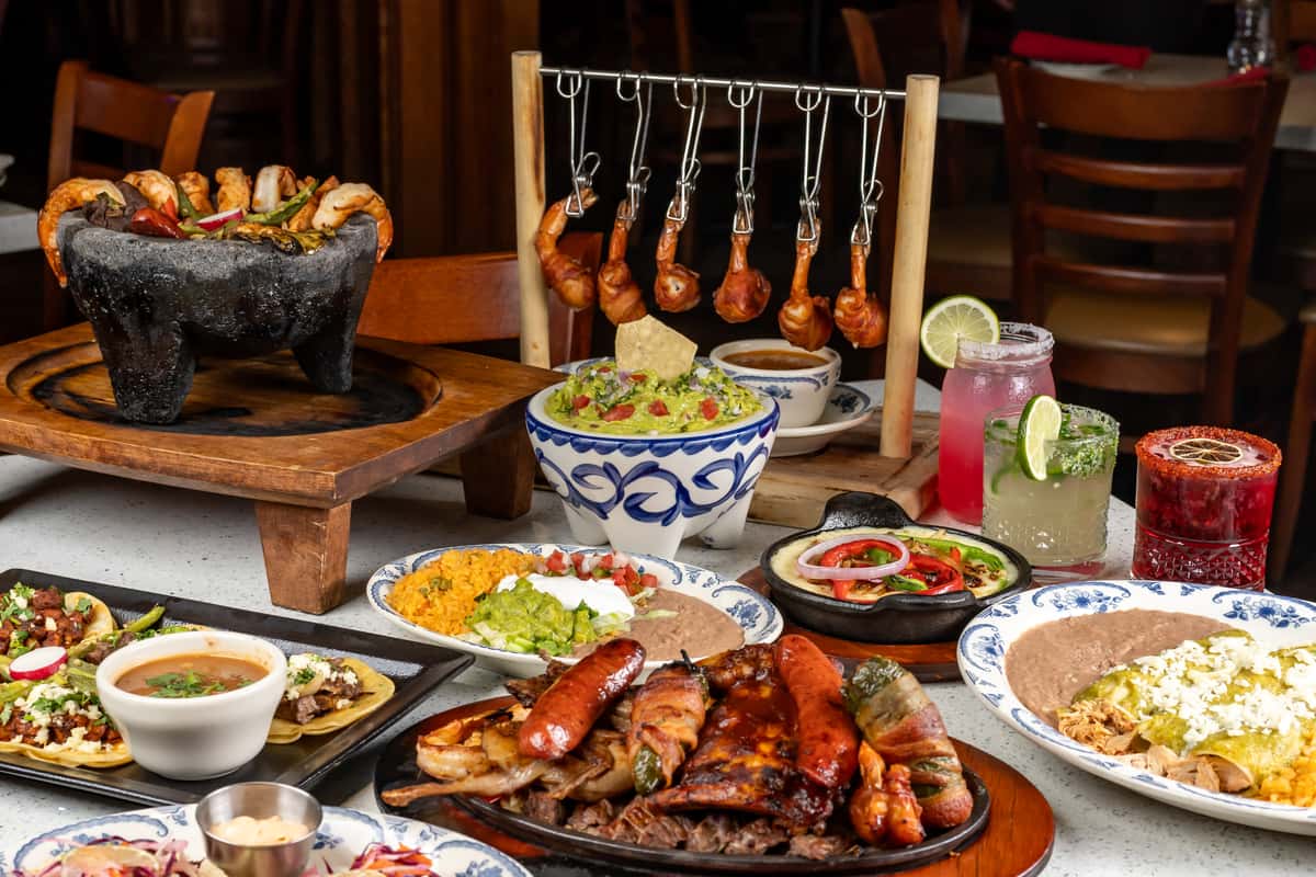 Table full of Mexican Dishes