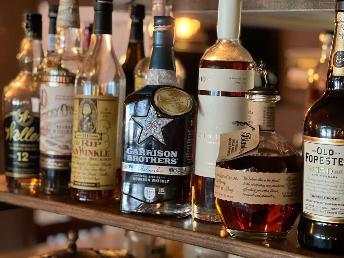 Bar shelf with bottles of alcohol