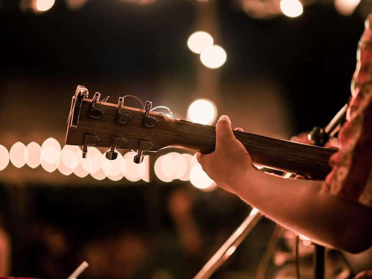 Closeup of a musician playing a guitar