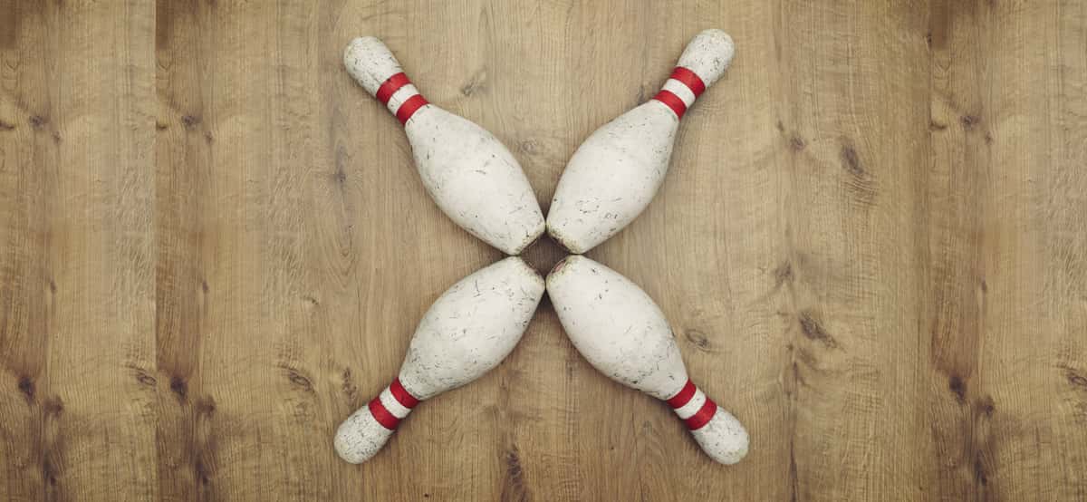4 bowling pins arranged as an X