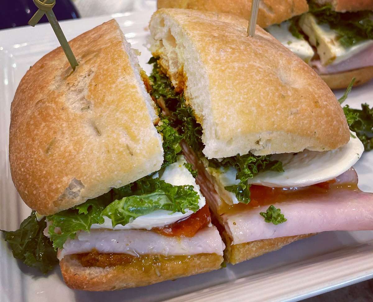 Roasted turkey on a rosemary focaccia roll topped with our scratch made spicy feta, fresh mozzarella, roasted peppers, and basil pesto. This is a party in your mouth!