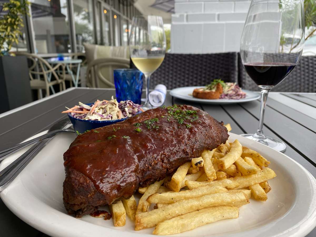 beef steak and french fries on a table