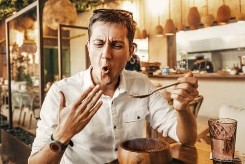Man eats super spicy thai food
