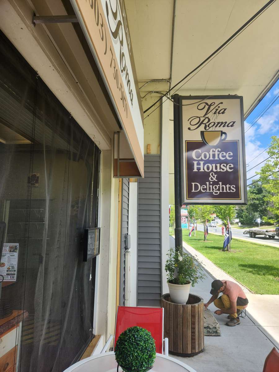 Coffee House Signage: Outside View -"Via Roma Coffee House & Delights"