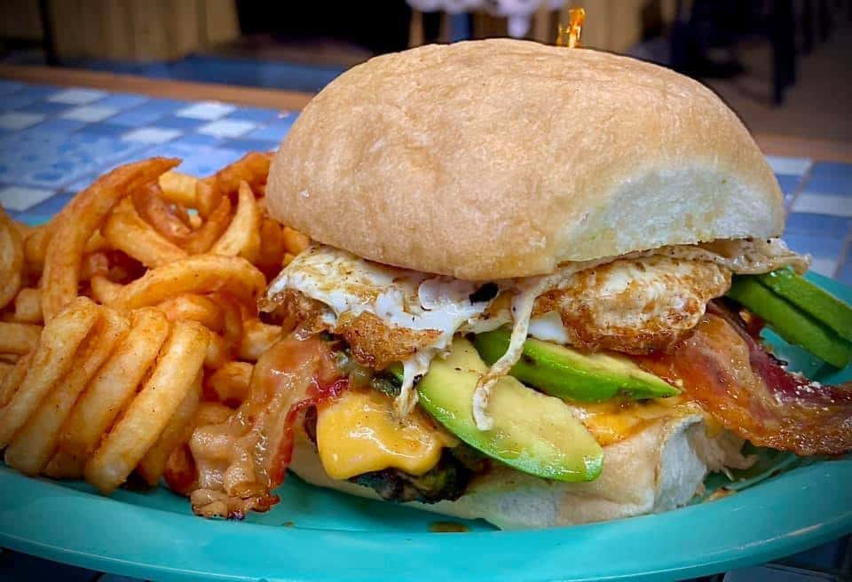 cheeseburger with bacon, egg, an avocado