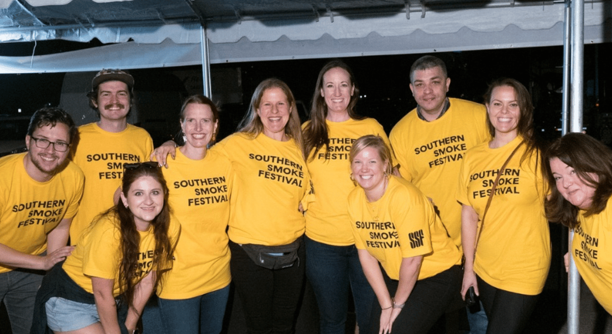 group of people in yellow shirts