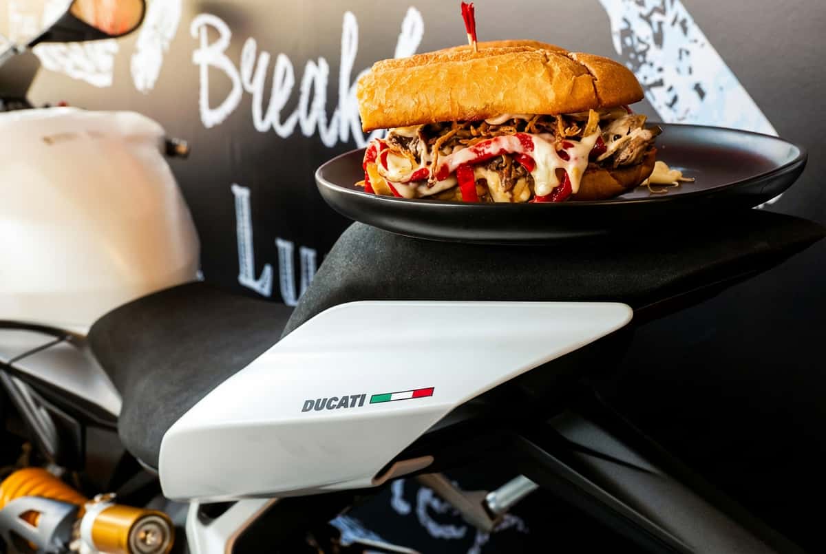 Burger next to Ducati motorcycle
