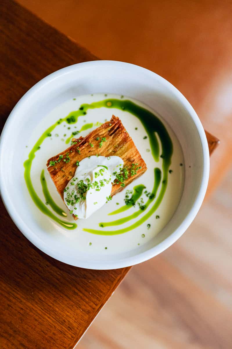 Plate of food with a green drizzled sauce